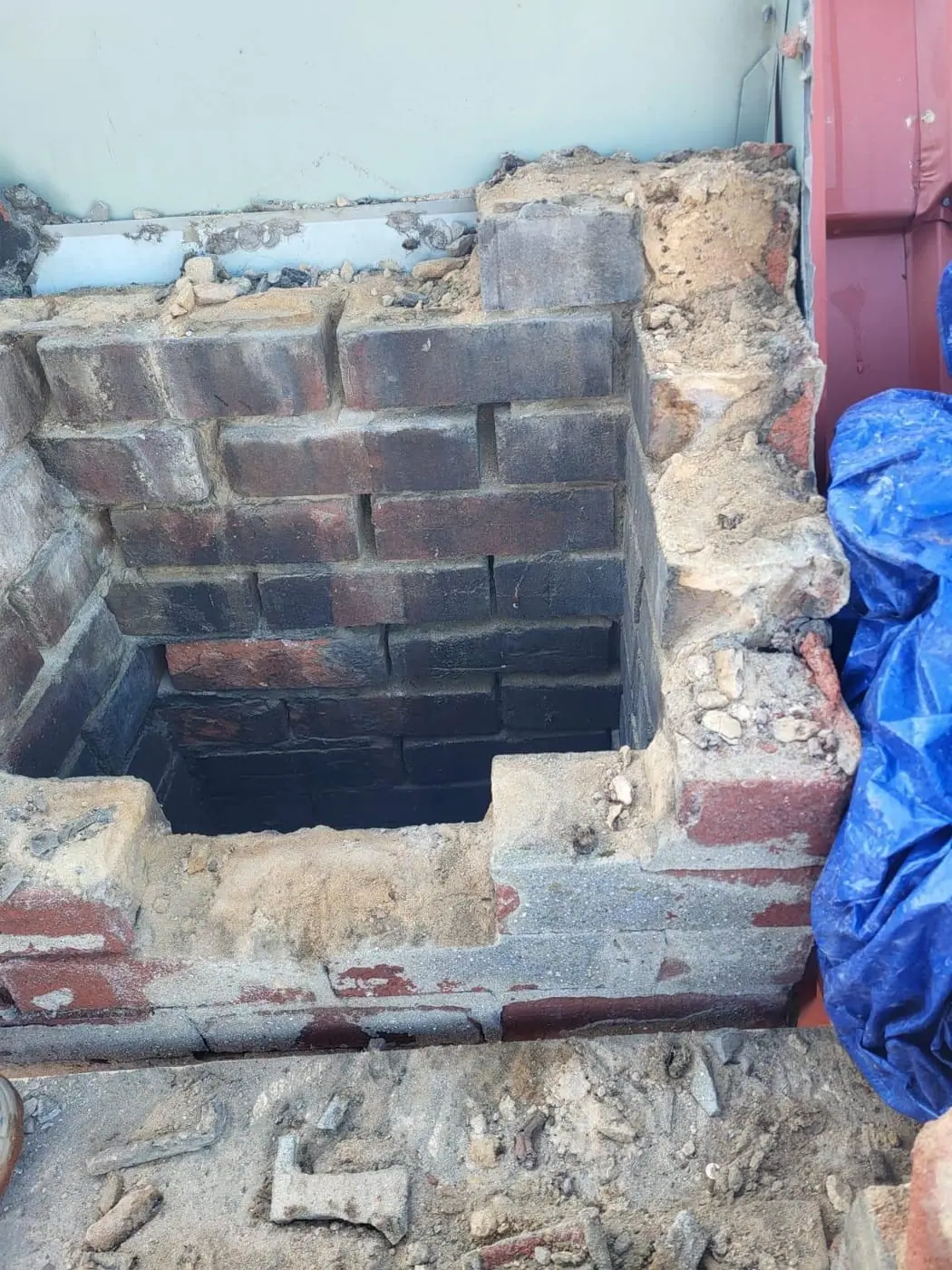 Novastone Contracting masonry work in progress: chimney brickwork taken down to the flue