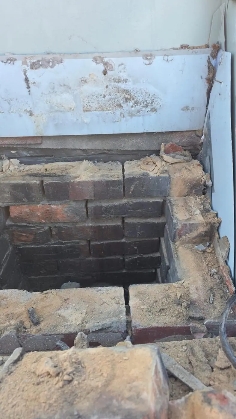 Novastone Contracting work in progress: dismantled chimney with old brick courses and mortar rubble